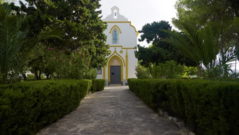 white chapel in a lush garden