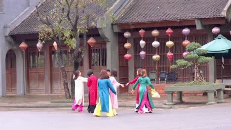 group in traditional attire strolling and conversing