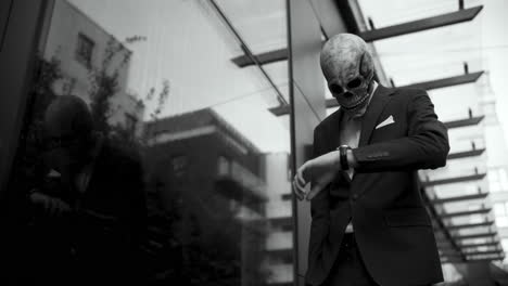 man in skull mask business suit