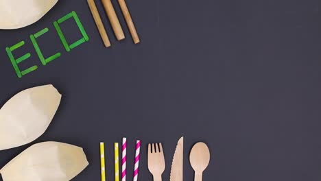 eco friendly zero waste bamboo cutlery appear on black background. stop motion