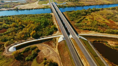 top view car bridge over river landscape. highway road aerial view