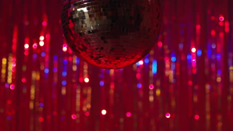 close up of mirrorball in night club or disco with flashing strobe lighting and sparkling lights in background 3