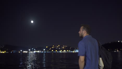 thoughtful man walking against cityscape.