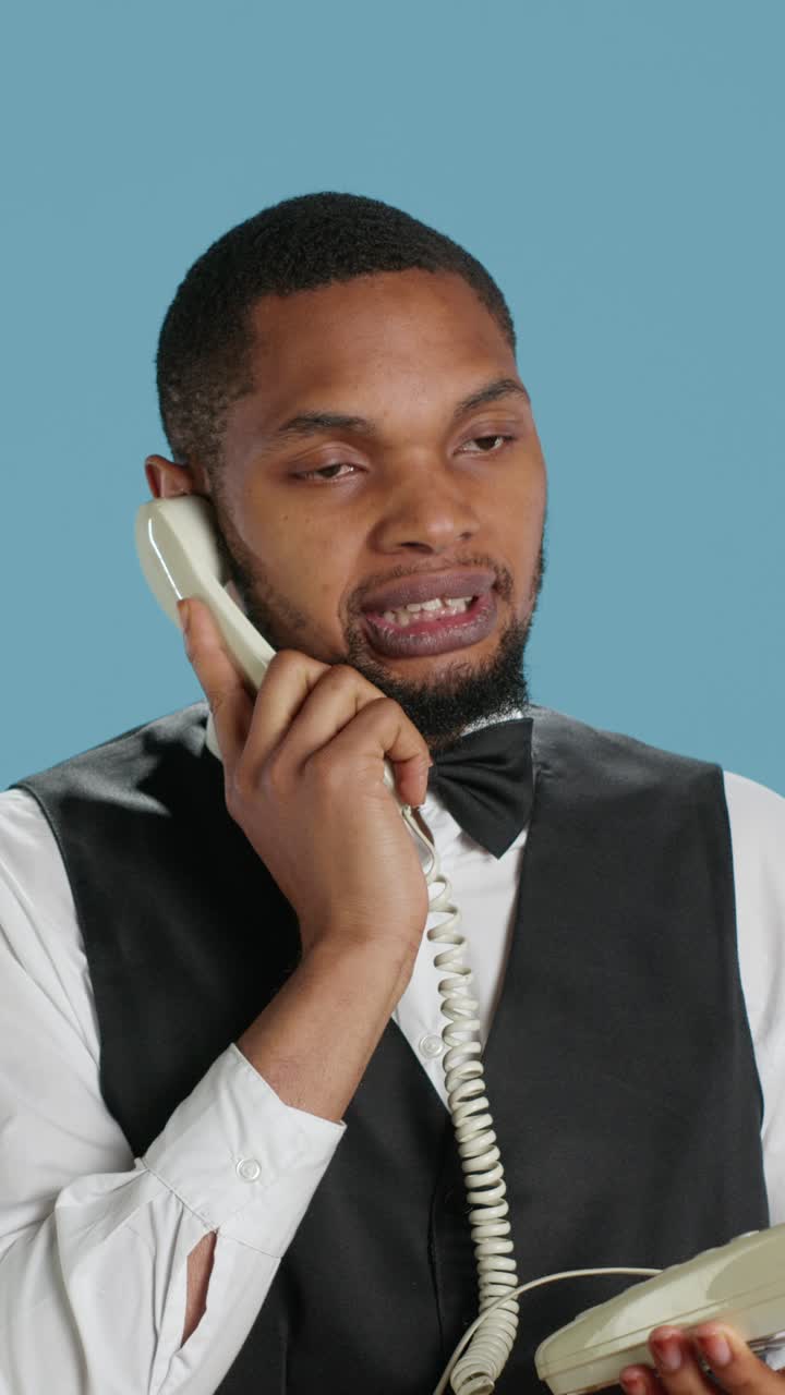 African American Man Talking on Vintage Landline Phone