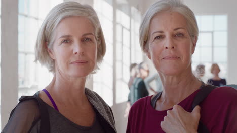 portrait beautiful old women twin sisters enjoying yoga class smiling happy middle aged siblings practice healthy fitness lifestyle in workout studio