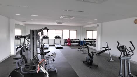new and clean gym with exercise equipment, no people