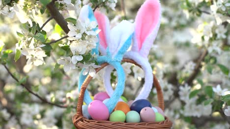 painted-Easter-eggs-in-basket-on-grass.-Traditional-decoration-in-sun-light