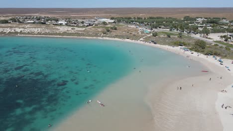 4K-People-in-paradise-large-beach-bay-aerial-shot-vacation-holiday-time