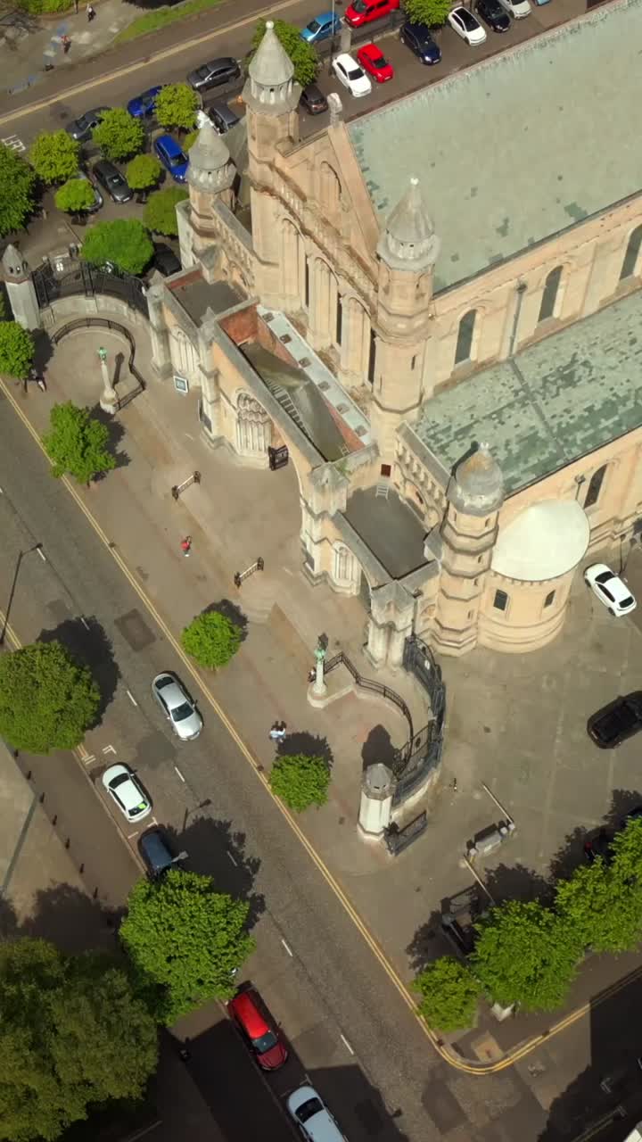 Passing overhead social ratio aerial of St Anne's Cathedral in Belfast City Centre, Northern Ireland. Filmed in 1080x1920 social ratio with Rec709 color