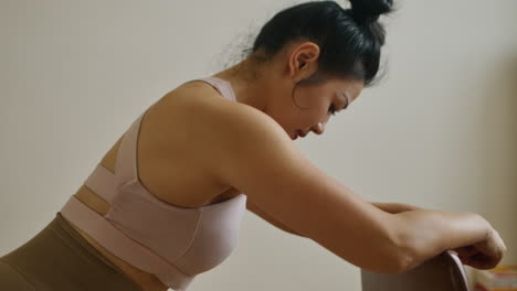 woman doing seated exercise at home