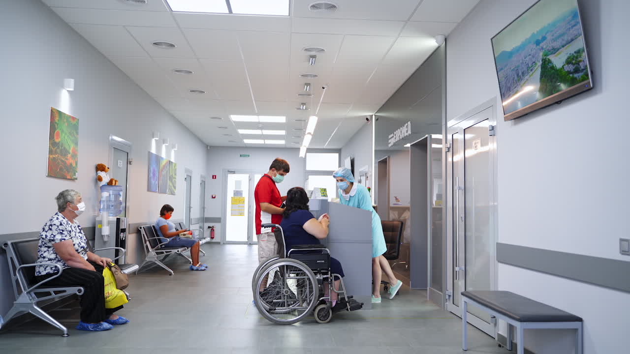 Hospital Waiting Area with Patients and Staff