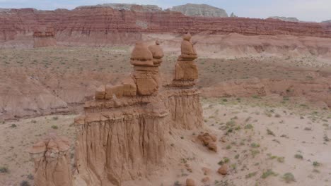 Aerial Drone Flight Around Stone Hoodoos Guarding the Valley of the Goblins State Park in Utah, USA