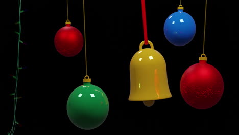 coloured christmas string lights flashing and colourful baubles swinging on black background