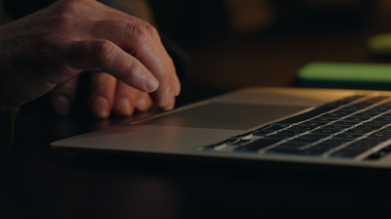 Night hands typing laptop closeup. Unrecognizable manager pressing touchpad