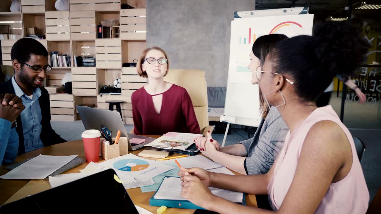 Multiethnic employees welcome female team leader. Young happy European businesswoman leads office startup meeting. 4K