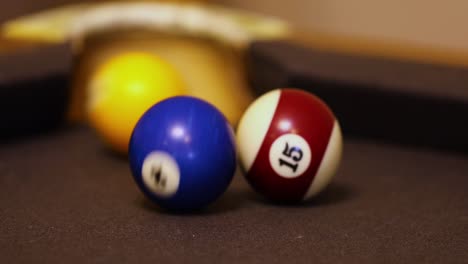 billiards with rolling colored and numbered balls selective