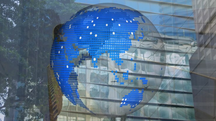 Animation of globe spinning over cityscape