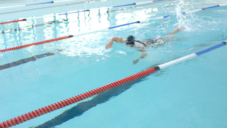 swimmer in action at a pool, with copy space