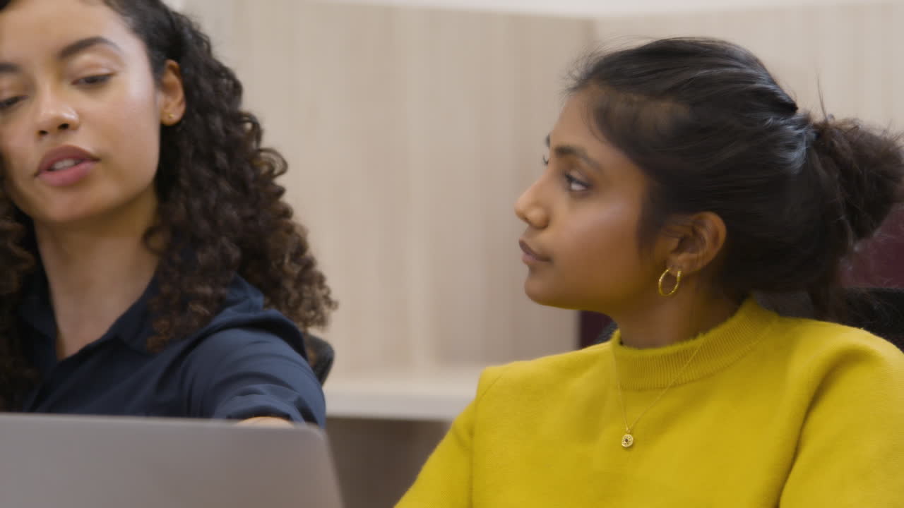 Female Colleagues Working Together In Office
