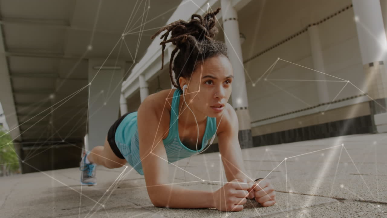 Animation of network of connections over fit biracial woman doing plank