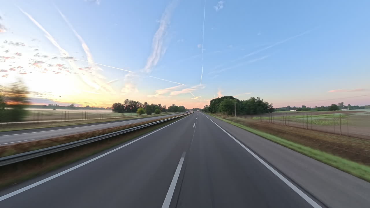 Driving on a Highway in Serbia at sunrise with nice contrails. Filmed with Insta360 X5