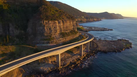 beautiful modern architectural design of sea cliff bridge in nsw australia - aerial shot