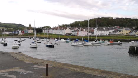 Boats-in-Aberaeron-harbor,-West-Wales,-slow-pan