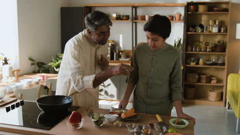 Father and Son Cooking Together in the Kitchen