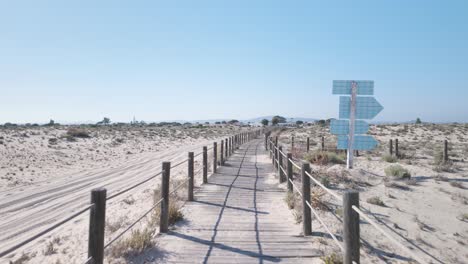 scenic boardwalk through sandy dunes on ilha da armona olhão portugal