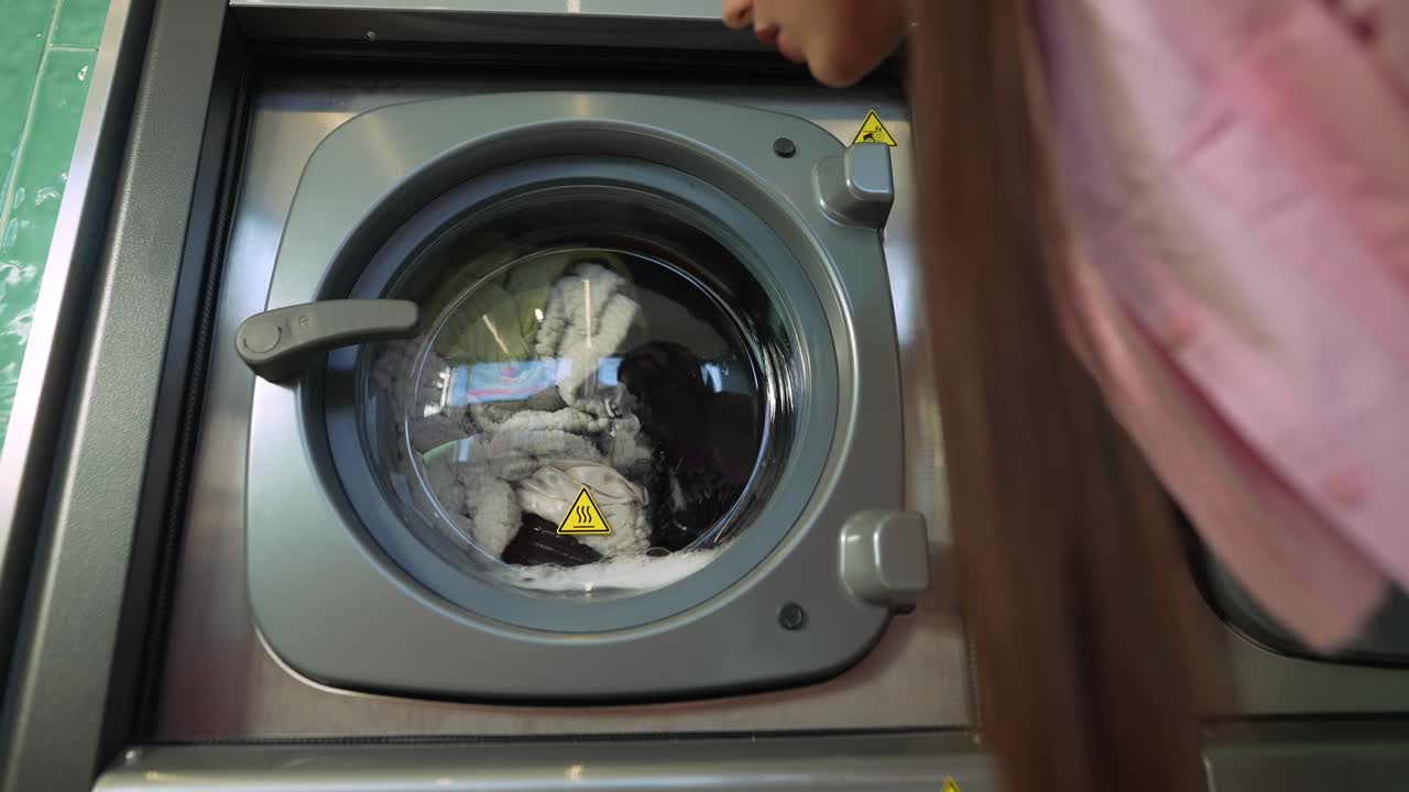 Woman using a Washing Machine