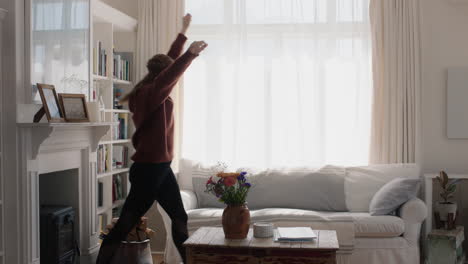 happy young woman dancing at home having fun celebrating with funny dance moves enjoying freedom on weekend 4k footage