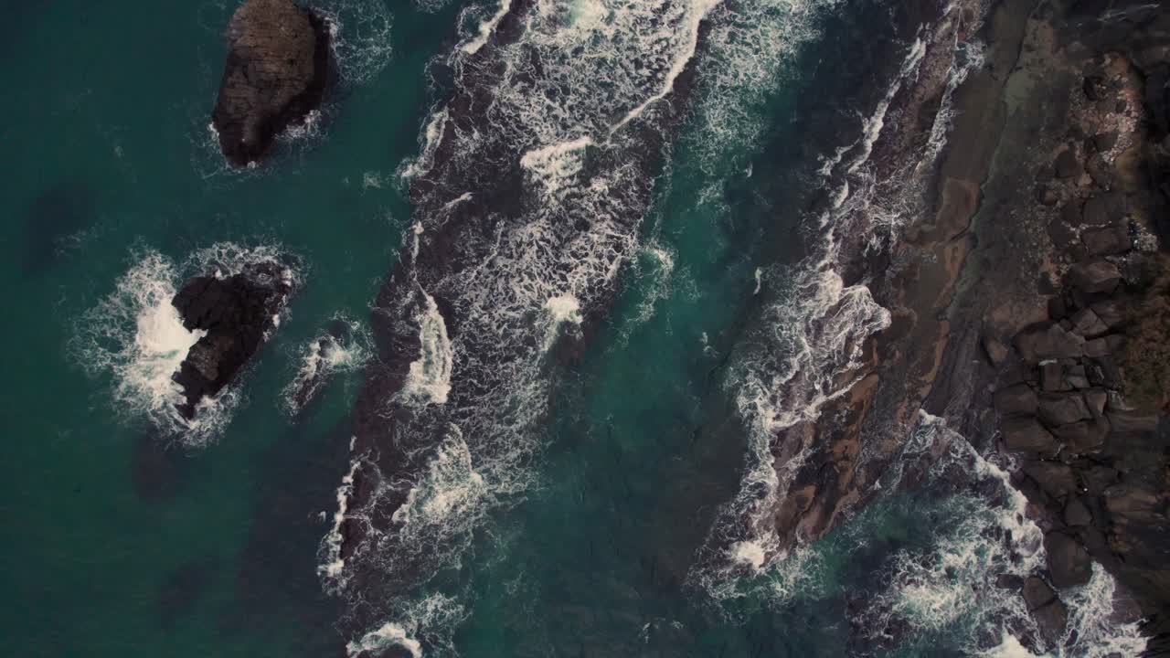 Top down aerial Japanese rock islets blue water waves crushing sea Kyotango kyoto beach japan travel destination