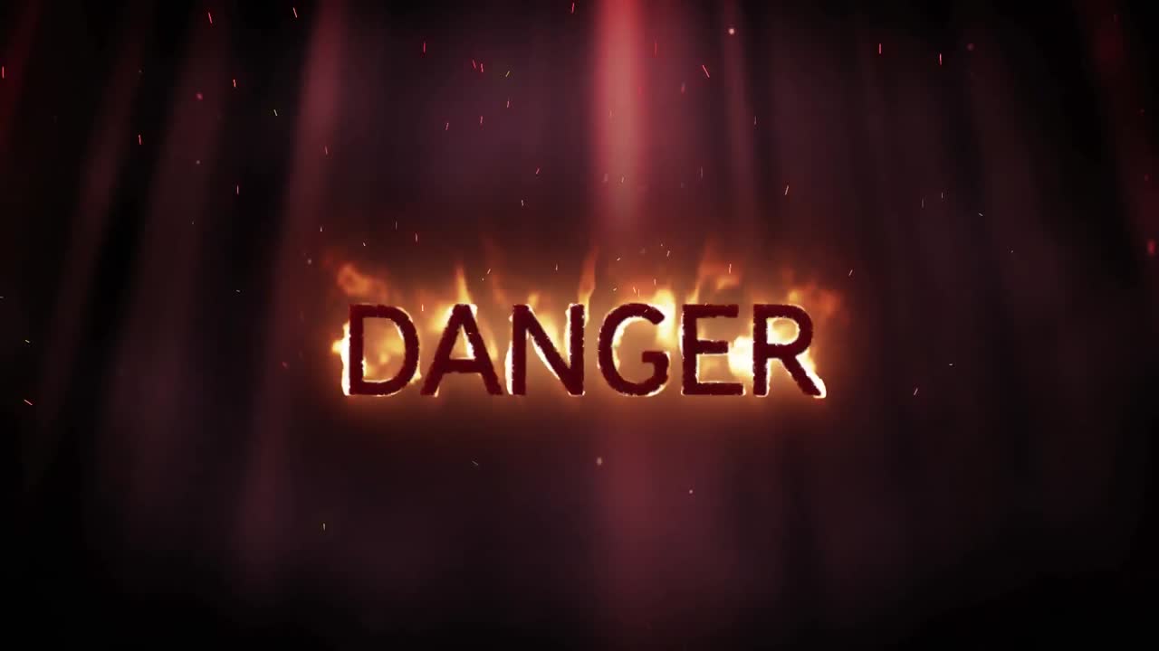 Danger in flames on black background