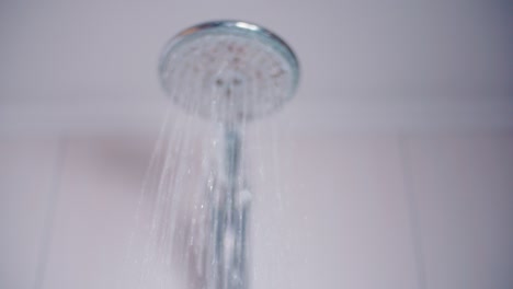 shower head turned on and off in slow motion