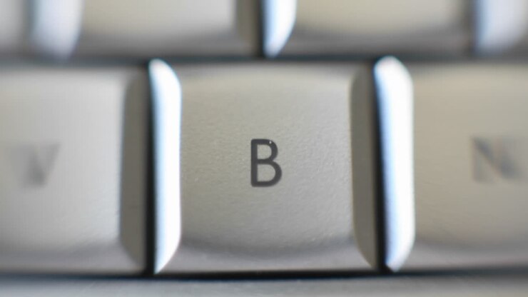 The capital letter B on a keyboard brought into focus