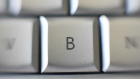 the capital letter b on a keyboard brought into focus