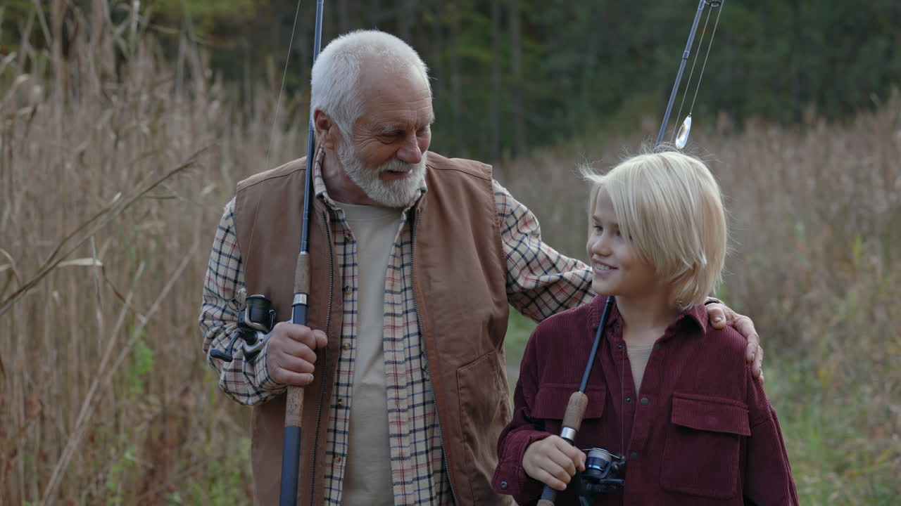 Grandfather and grandson bond during a fishing trip in nature