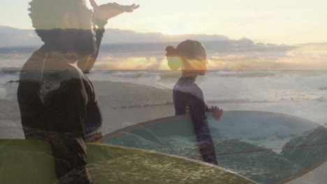 two surfers shading eyes and holding surfboard at beach sunrise, with animated tech data overlays