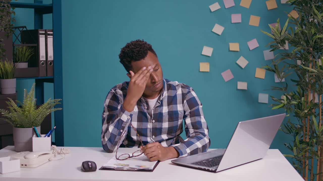 Young adult feeling exhausted and working overtime