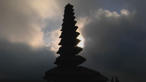 part of a balinese temple stands in silhouette 2