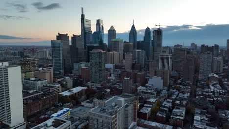 aerial pullback shot reveals philly skyline cityscape at dawn