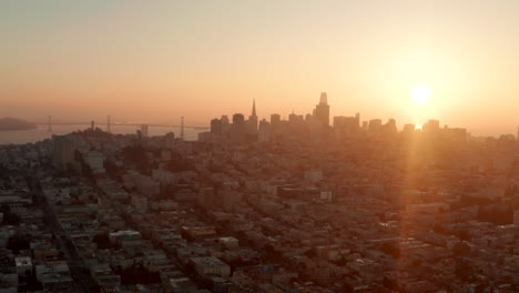 Slow-dolly-forward-aerial-shot-over-San-Francisco-city-at-sunrise