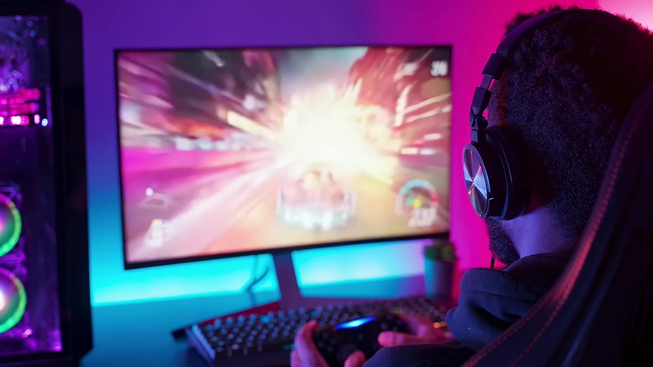 Gamer Wearing Headphones Playing Racing Video Game on PC