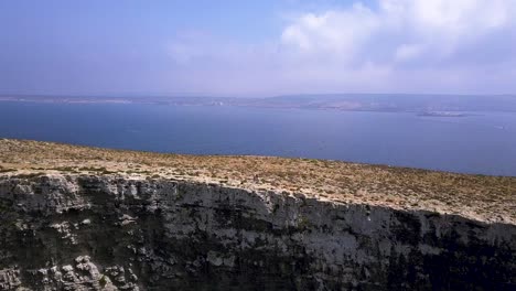 aerial footage showing part of comino island and malta island in the back