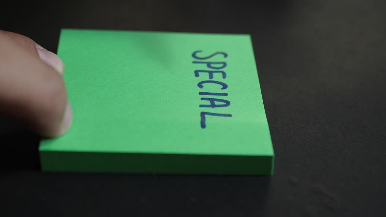 Special offer announcement sale in retail shop, handwritten on sticky post-it note