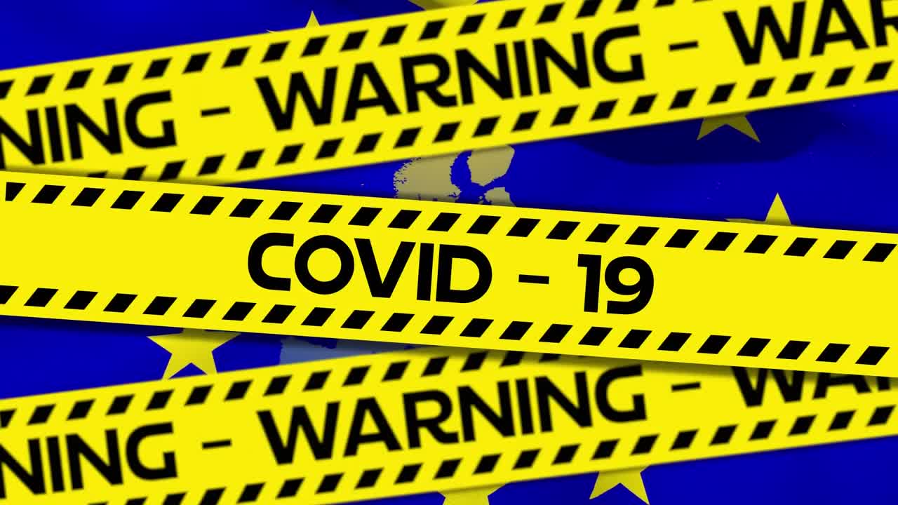 Yellow police tapes with words Warning Covid-19 text against EU map and flag
