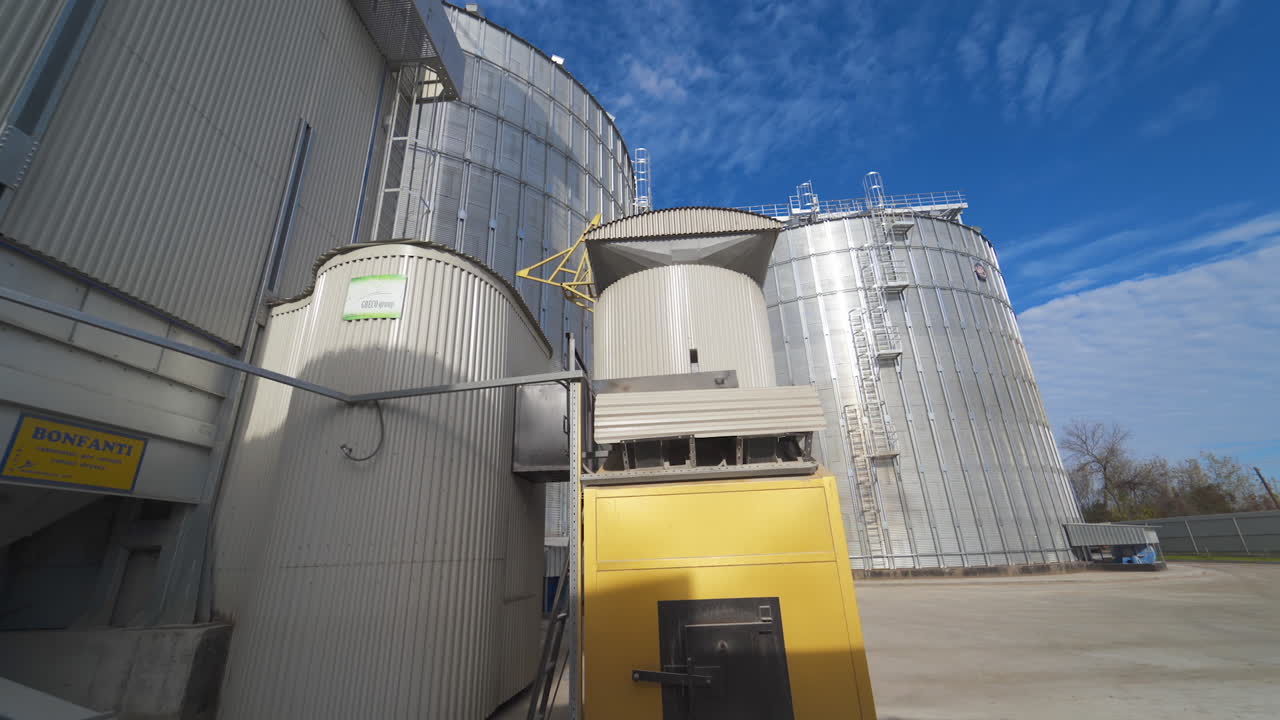 Metal grain elevator in agricultural zone. Grain warehouse