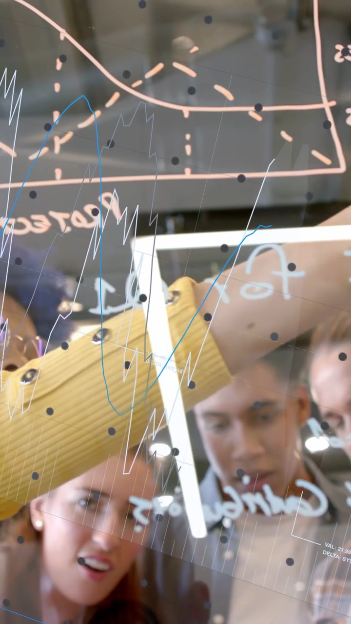 Vertical video: Lead woman stepping, drawing on glass board, causing animated graphs for business