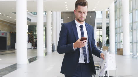 Businessman,-phone-and-travel-luggage