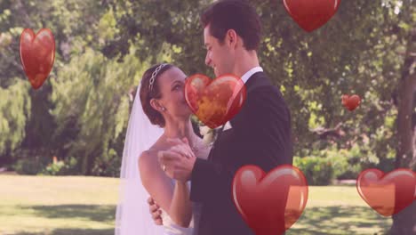 Animation-of-hearts-over-newly-married-caucasian-couple